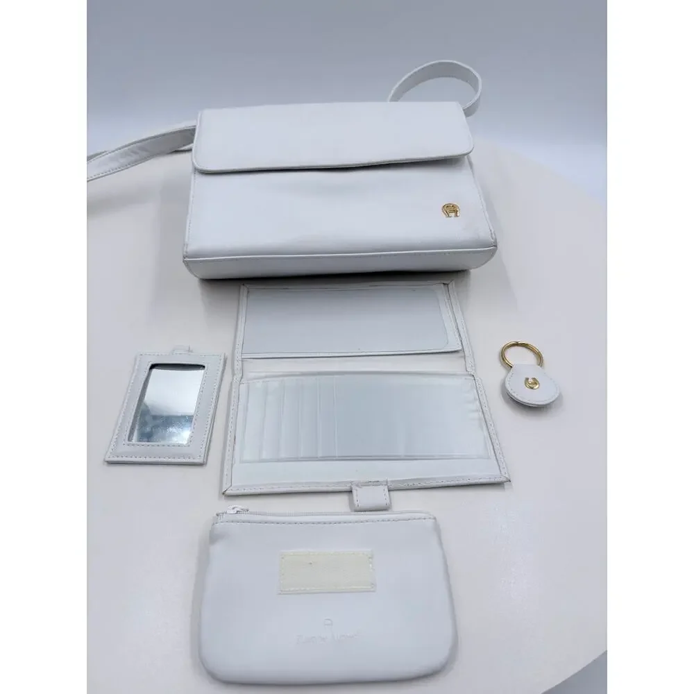 Ettienne white crossbody with wallet, makeup purse, detachable key ring and more